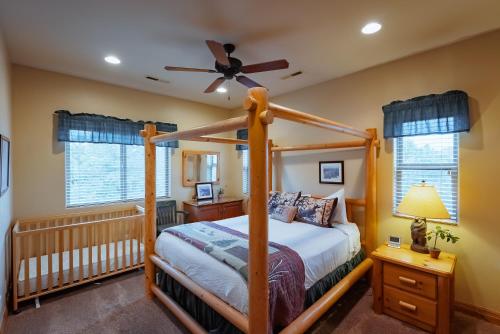 a bedroom with a bed and a ceiling fan at Zion Ponderosa Ranch Resort in Springdale