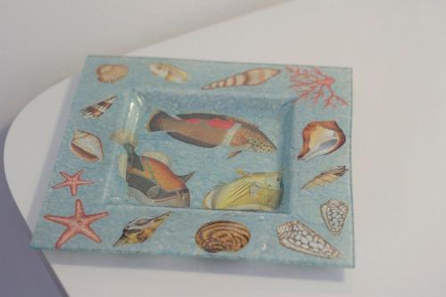 a cake with fish and shells on it at A Babordo B&B in Trapani