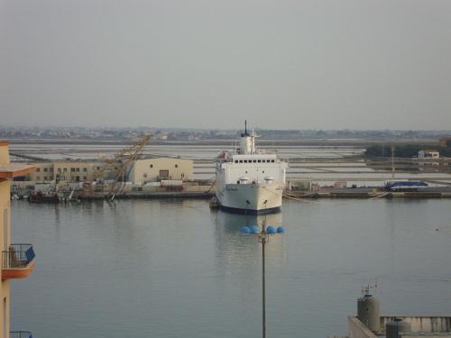 a large boat is docked in a harbor at A Babordo B&B in Trapani