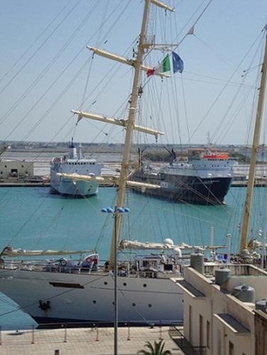 two large boats are docked in a harbor at A Babordo B&B in Trapani