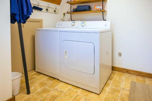 a white washer and dryer in a room at Furnished Deck + Fire Pit: Happy Jack Cabin in Happy Jack