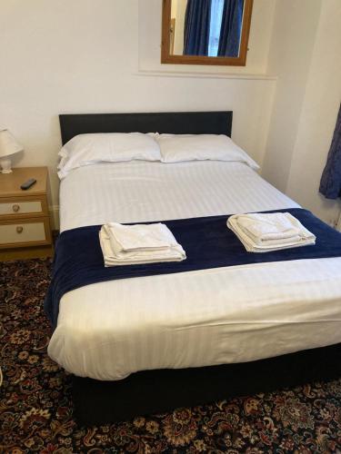 Katil atau katil-katil dalam bilik di Abingdon Lodge Hotel
