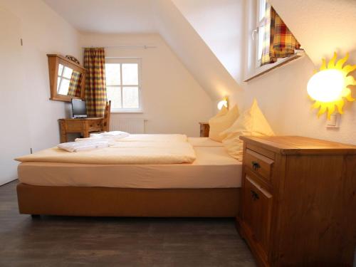 a bedroom with a bed and a staircase with a window at Ferienhaus in Wernigerode mit Innenpool in Wernigerode