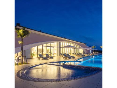 a view of a resort pool at night at Miyakojima Kurima Resort Seawood Hotel - Vacation STAY 16233v in Uechi
