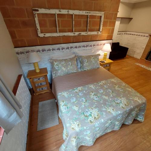 Ένα ή περισσότερα κρεβάτια σε δωμάτιο στο Casa no Céu
