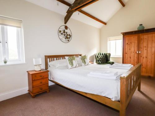 Ένα ή περισσότερα κρεβάτια σε δωμάτιο στο Wheal Rose