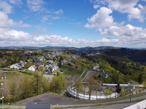 a view of a small town in the mountains at Altastenberger Lodge in Winterberg