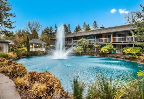 a fountain in a pool in front of a building at Best Western Portland West Beaverton in Portland