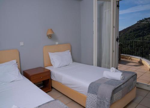 Ένα ή περισσότερα κρεβάτια σε δωμάτιο στο Bellina Villa