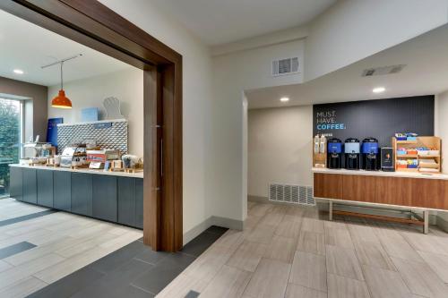 a view of the front counter of a coffee shop at Holiday Inn Express & Suites Waxahachie by IHG in Waxahachie