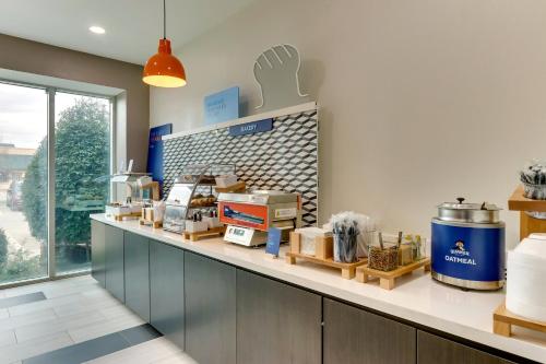 a kitchen with a counter with items on it at Holiday Inn Express & Suites Waxahachie by IHG in Waxahachie