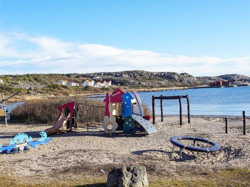 a playground on the beach with at 8 person holiday home in Grebbestad-By Traum in Grebbestad