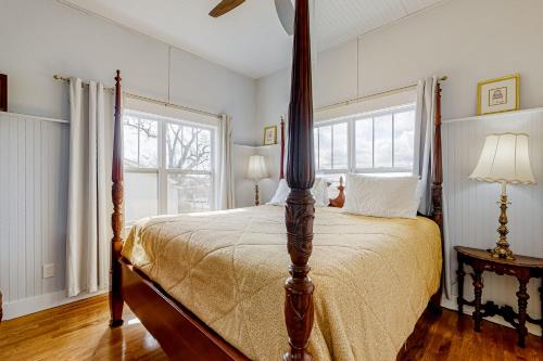 a bedroom with a bed and a large window at Holbert House in Jasper