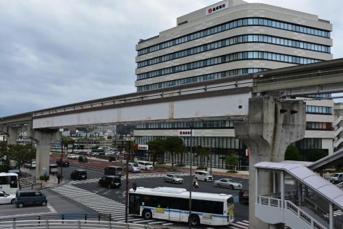 a city with a large building and a street with cars at GEORGE HOUSE in Tsuji in Naha