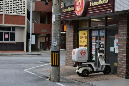 a scooter parked in front of a store at GEORGE HOUSE in Tsuji in Naha
