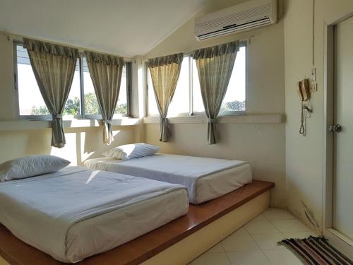 Postel nebo postele na pokoji v ubytování Casa Holiday Hotel SHA
