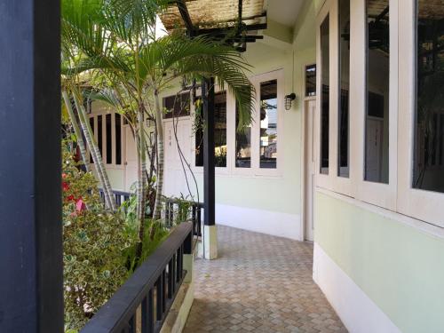 a walkway leading to the front door of a house at Casa Holiday Hotel SHA in Phitsanulok