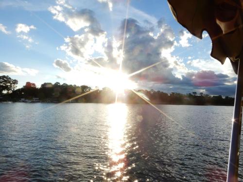 a sun setting over a body of water at Eildon Parkview Motor Inn Room 4 in Eildon