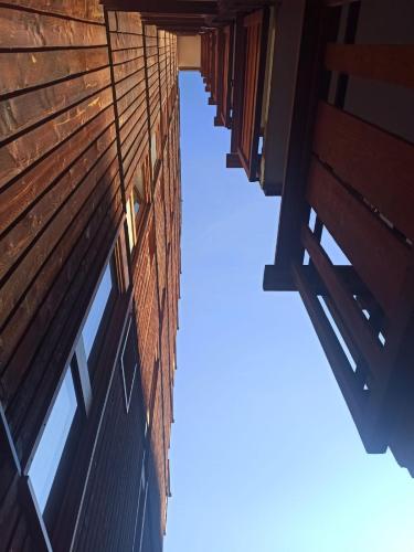 a row of windows on the side of a building at Studio transformé en 2 pièces avec cloison amovible sur La Plagne Bellecôte in Sangot