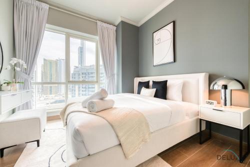 Postel nebo postele na pokoji v ubytování Delightful 1BR at Al Majara 2 Dubai Marina by Deluxe Holiday Homes