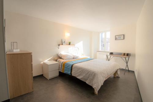 Säng eller sängar i ett rum på CABANA & Duplex - Cluny à 20 minutes