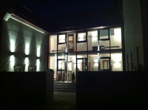 a building at night with its lights on at Genießerhotel Limbacher in Herrieden