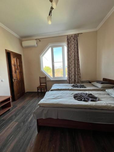 Ένα ή περισσότερα κρεβάτια σε δωμάτιο στο Guest House Evkalipt