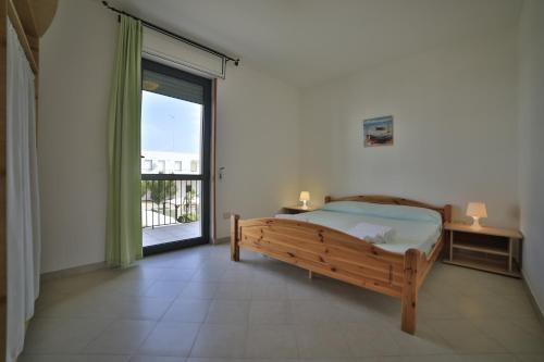 Postel nebo postele na pokoji v ubytování Residence Cala Verde