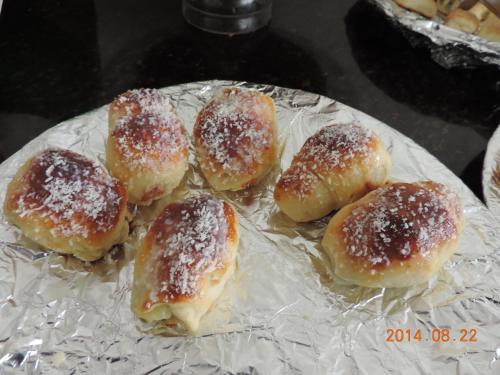 a group of donuts covered in powdered sugar on a plate at Ilhabela Park Hotel in Brasilia