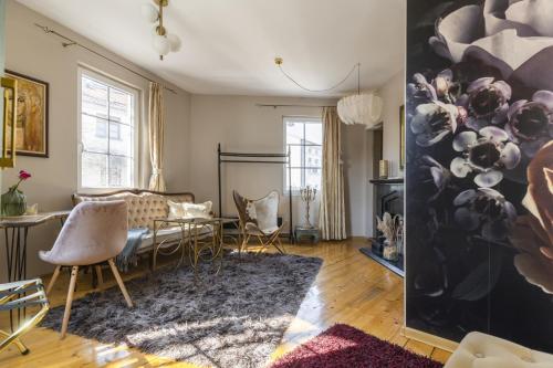 a living room with a table and chairs at Boutique City Villa in Old Town in Plovdiv