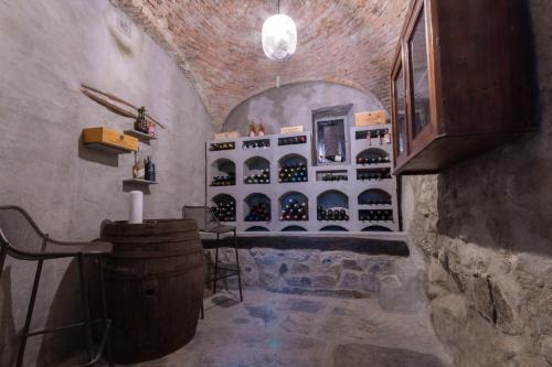 a wine cellar with a barrel and a tasting room at Casa ToBé in Menaggio