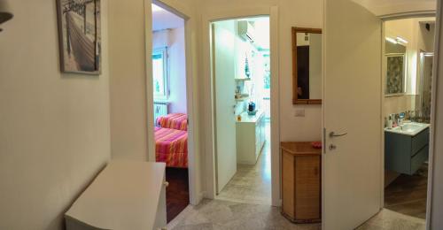 a bathroom with a bed and a sink in a room at La Palma in Rapallo