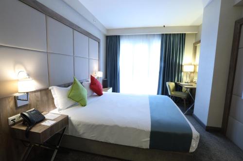 Ένα ή περισσότερα κρεβάτια σε δωμάτιο στο ibis Styles Istanbul Bomonti
