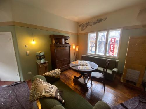 a living room with a couch and a table at Spurensucher Quartier in Usedom Town