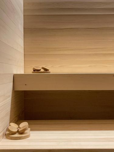a bathroom with three toilets sitting on a shelf at Encanto Agriturismo & Private SPA in Visogliano