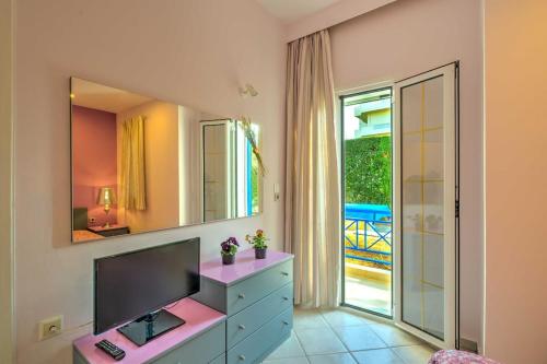 a bathroom with a sink and a mirror at apartment in Amoudara of Heraklion-4 in Ayía Marína