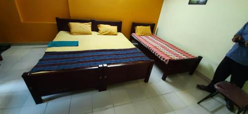 En eller flere senge i et værelse på Tourist home