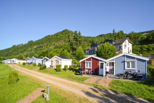 a row of houses on a dirt road at M13 Hotel in Riol