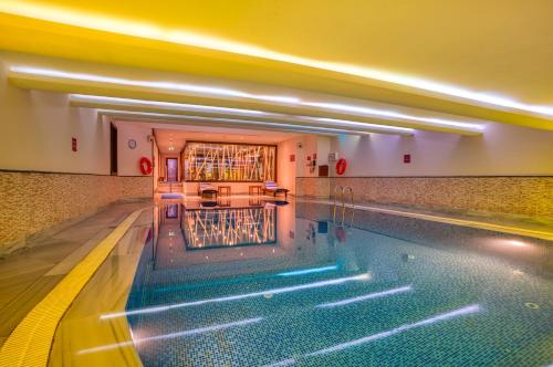 a swimming pool in a building with a swimming pool at Crowne Plaza Istanbul - Old City, an IHG Hotel in Istanbul