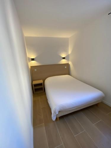 Кровать или кровати в номере Hôtel Raphael Prado