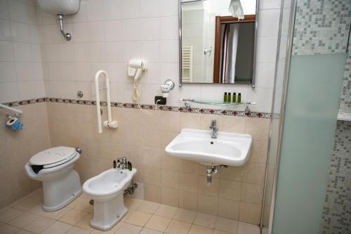 a bathroom with a toilet and a sink and a shower at Villa Le Zagare Relais & SPA in Gragnano