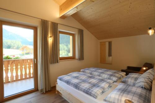 Llit o llits en una habitació de Ferienwohnungen Unterangerhof