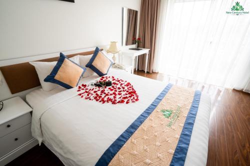 Ένα ή περισσότερα κρεβάτια σε δωμάτιο στο New Century Hotel