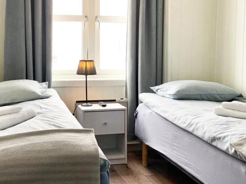 Cama o camas de una habitación en Båtsfjord Brygge - Arctic Resort