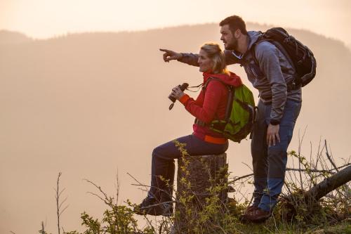 a man and a woman standing on top of a mountain at Hotel Tiefenhagen Sauerland in Lennestadt