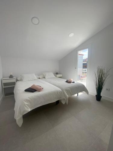 Ένα ή περισσότερα κρεβάτια σε δωμάτιο στο Design Club Santander