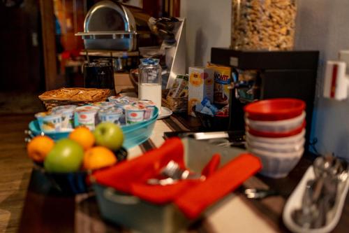a kitchen counter with fruits and food on it at Hotel Tiefenhagen Sauerland in Lennestadt