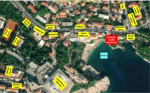 a map of a city with houses and a beach at Apartment Pulastar in Dubrovnik