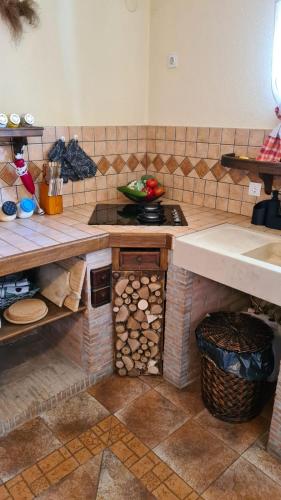 a kitchen with a stove and a counter top at Holiday House Nika in Vrbovsko