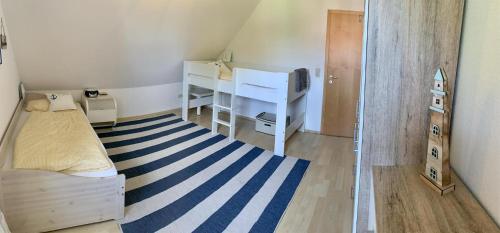Katil atau katil-katil dalam bilik di Ferienhaus DeVriesenkoje